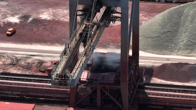 Cranes Unloading a Bulk Carrier at Port