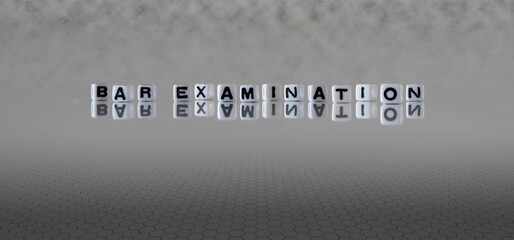 bar examination word or concept represented by black and white letter cubes on a grey horizon...