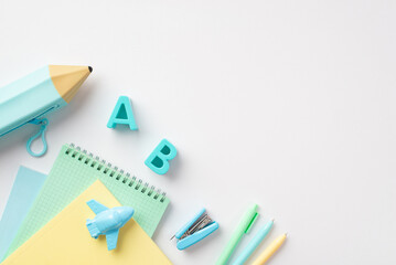 Back to school concept. Top view photo of school supplies blue pencil-case alphabet letters...