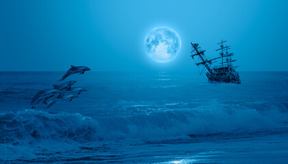 Night sky with moon in the clouds  
with Sailing old ship in storm sea -  