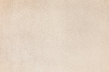 Fototapeta na wymiar Texture of beige plaster wall as background