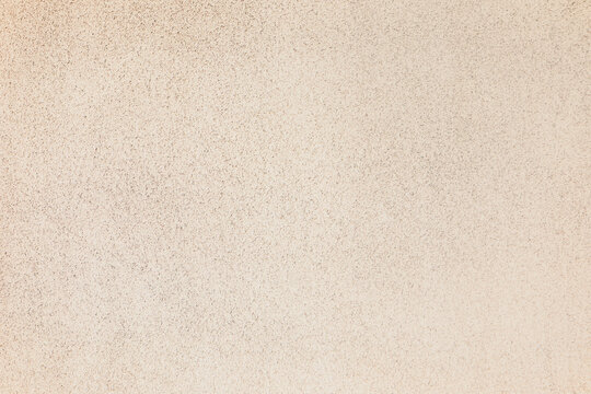 Texture of beige plaster wall as background