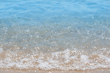 Beautiful view of sea wave on sandy shore