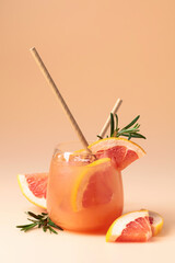 Summer cocktail with grapefruit, rosemary, and ice.