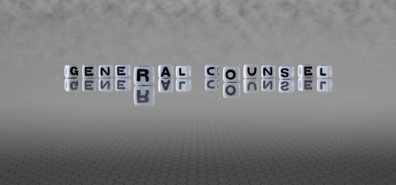general counsel word or concept represented by black and white letter cubes on a grey horizon background stretching to infinity