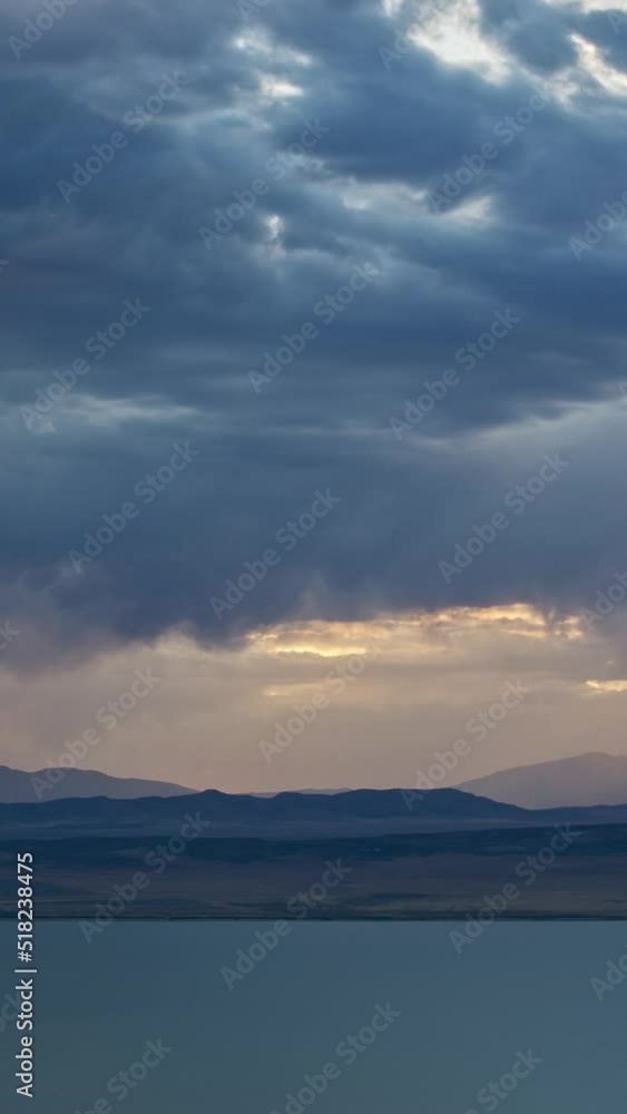 Canvas Prints timelapse of sunset and rainstorm moving in towards utah lake as dark clouds roll through the sky.