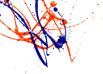 Drops of red and blue paint on a white background.