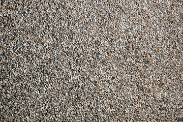 Small pebbles of crushed stone as an abstract background.