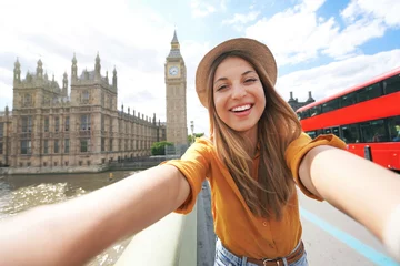 Papier Peint photo Lavable Bus rouge de Londres Smiling tourist girl taking self portrait in London, UK. Selfie photo of happy woman traveling in London with Big Ben tower, Westminster palace and double decker red bus on summer sunny day.