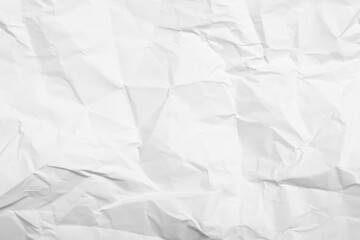 Obraz premium Sheet of white crumpled paper as background, closeup
