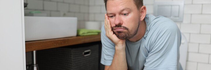 Bored man on toilet seat dream about something, fulfill natural need