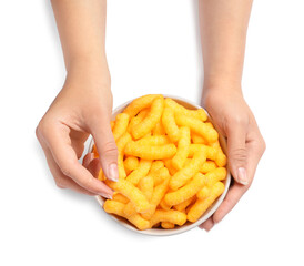 Woman holding bowl of crunchy cheesy corn sticks on white background, top view