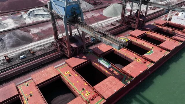 Bulk Carrier Ship Offloading Cargo By Crane for Processing