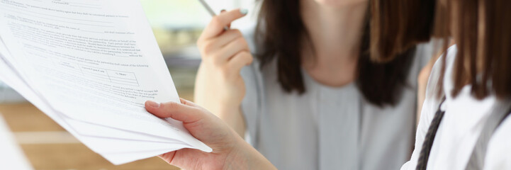 Business consultant showing business graphic report to colleague