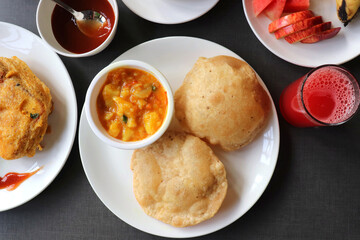 Indian cuisine - Puri Bhaji. It is a traditional breakfast dish in North India. Puri is a deep...