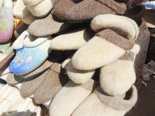 Russian folk crafts - traditional products made of felt and wool - felt shoes