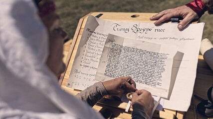 Writing important document in 14th century - reenactment event