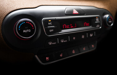 Air conditioning button inside a car. Climate control AC unit in the new car. Modern car interior details. Car inside.