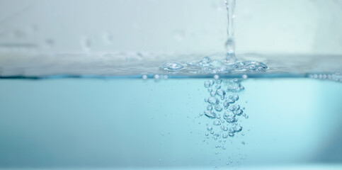 Naklejka na ściany i meble de-focused. Closeup of light blue transparent clear calm water surface texture with splashes and bubbles. Trendy abstract summer nature background. for a product, advertising,text space.