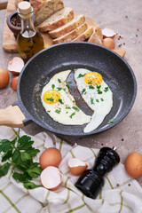 Close up view of the fried egg on a frying pan