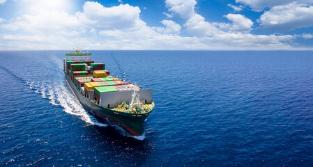 Aerial front view of a container cargo vessel traveling over the ocean with copy space as a banner