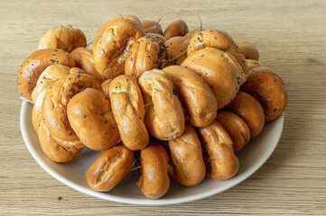 a pile of round cakes with a hole in a plate on the table