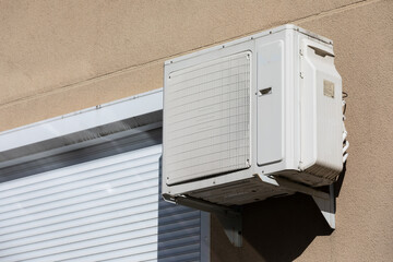 block of climatic equipment of the air conditioner hanging outside the building