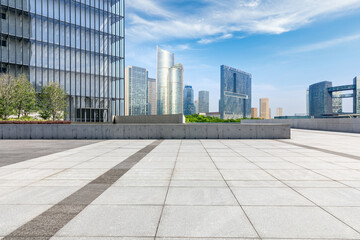 Fototapeta na wymiar Empty square floor and city skyline with modern commercial buildings in Hangzhou, China.