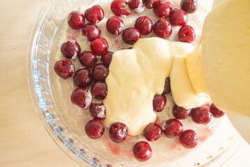 the process of making cherry pie. Adding dough to cherries in a glass bowl. Morning Routine Perfect Cherry Pie Recipe Ingredients