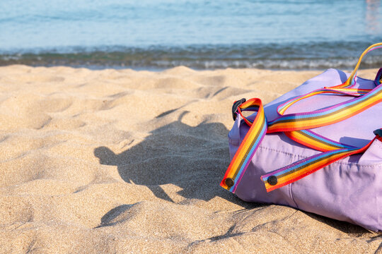 Hipster hiker tourist yellow backpack, swimming mask on background blue sea ocean horizon on sand beach, blur panoramic seascape blank, traveler relax holiday concept, sunlight view in trip vacation - Powered by Adobe