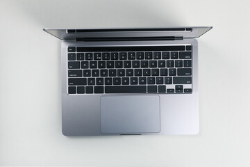 Fototapeta na wymiar Open laptop on white background, top view