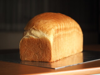 whole loaf of golden brown baked white bread