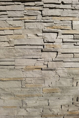 Texture stone wall brown mosaic tiles of background.