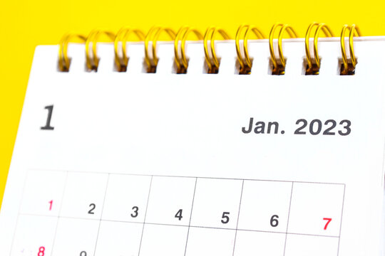 January close-up of 2023 desk calendar for planners and reminders on a yellow background