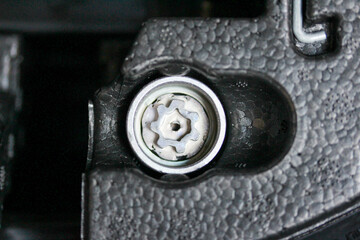 Extreme close up of a lock nut key