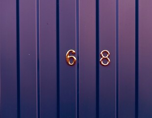 The numbers six and eight on the steel fence