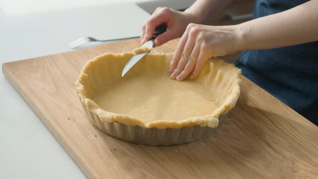 Woman making a base for lemon tart