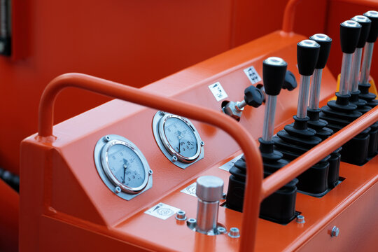 lever arms and gauges on a control console