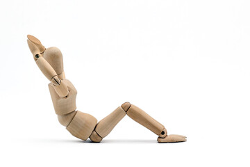 a wooden mannequin doing exercises on white background. warm up exercise
