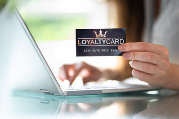 Hand Holding Loyalty Rewards Bonus Program