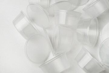 Transparent plastic containers for sauces and dressings. Disposable tableware for food delivery...