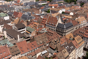 Fototapeta na wymiar Beautiful view to old town of Strasbourg. Alsace. France. Old medieval buildings with red roofs
