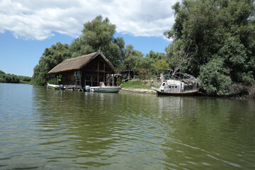 Fototapeta na wymiar floating wood house in danube delta which belonged to late ivan patzaichin, caiac canoe world champion