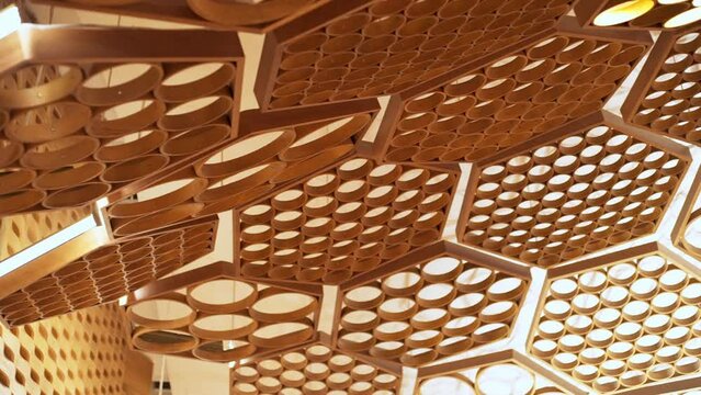 Closeup of the complex sound treatment ceiling architecture in the auditorium of the Seine Musicale in Paris, France