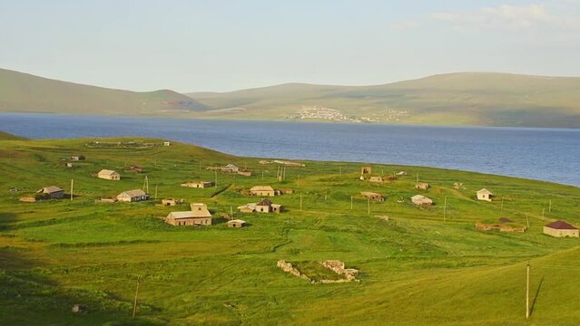 Abandoned Vladimirovka village by Paravani lake in summer