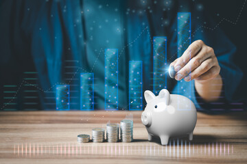 Man putting coin into piggy bank for saving money concept, business finance and investment.