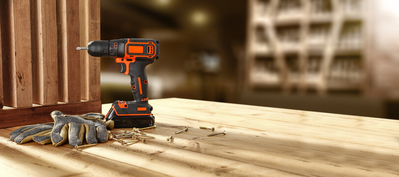 Drill on table and workshop interior. Free space for your products. 