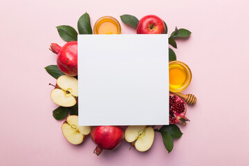 Flat lay composition with Blank flyer poster and symbols jewish Rosh Hashanah holiday attributes on...