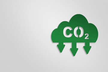 CO2 emission reduction icon on cloud , paper cut for CO2 emission ,green industries business . Net zero emissions. renewable energy, sustainable technology, ecology solutions concept with copy space
