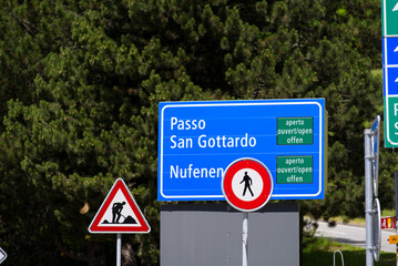 Traffic signs at mountain village Airolo, Canton Ticino, on a sunny summer day. Photo taken June 25th, 2022, Airolo, Switzerland.